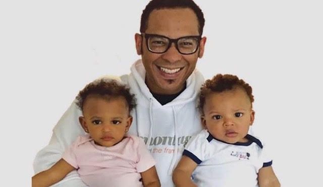 James Oliver Jr. pictured here with his two children: his "twin-nado"
