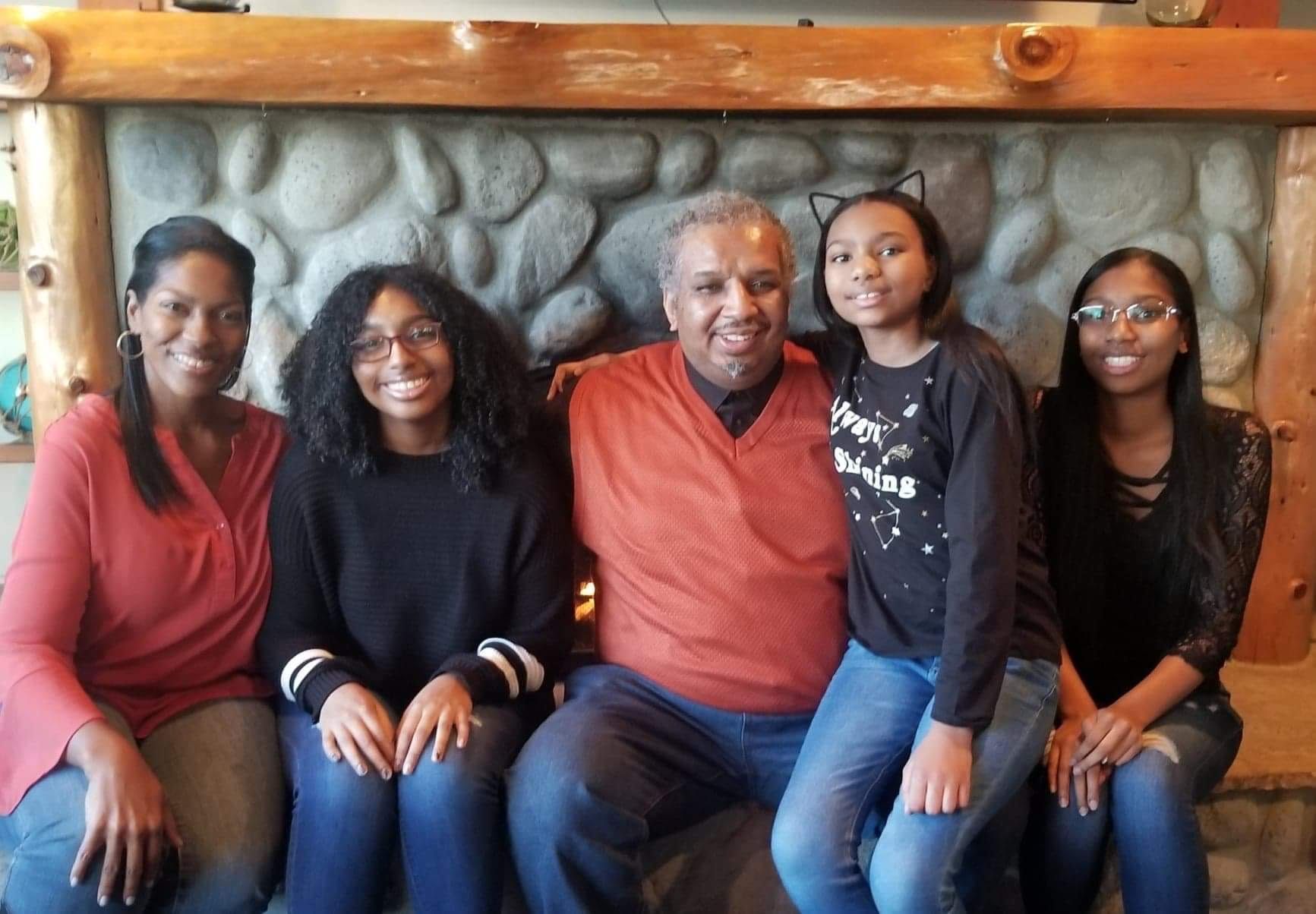 Michael with his wife and three daughters.