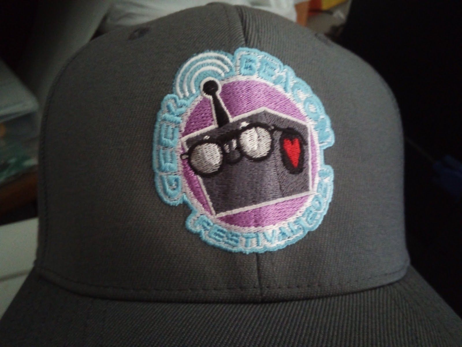 GeekBeacon's New Merch - black baseball cap with a robot