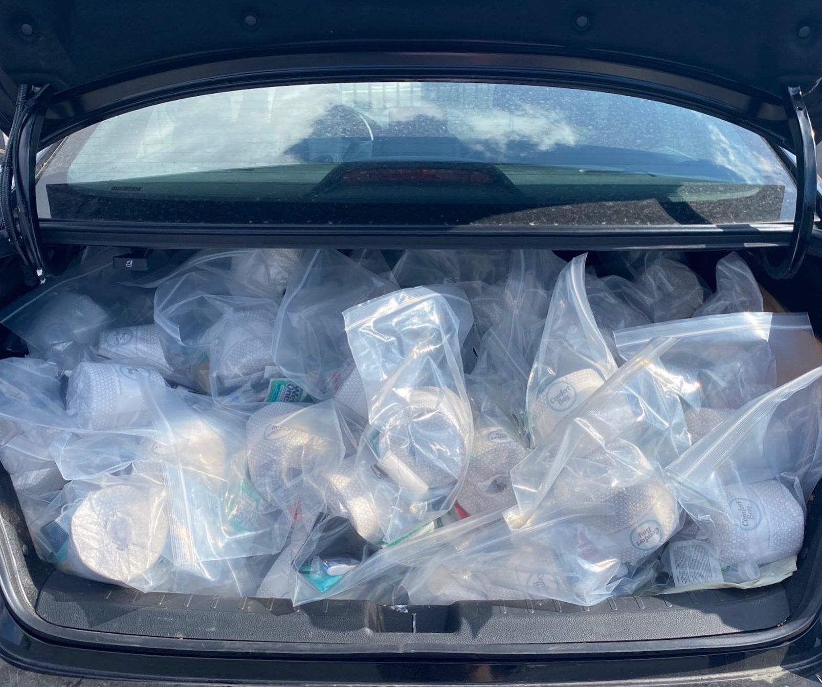 Bagged hygeine kits in the trunk of a car to be distributed from LA Street Care