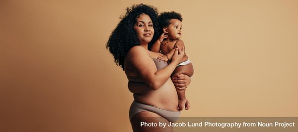 New mother comfortable with her post pregnancy body by Jacob Lund Photography from NounProject.com